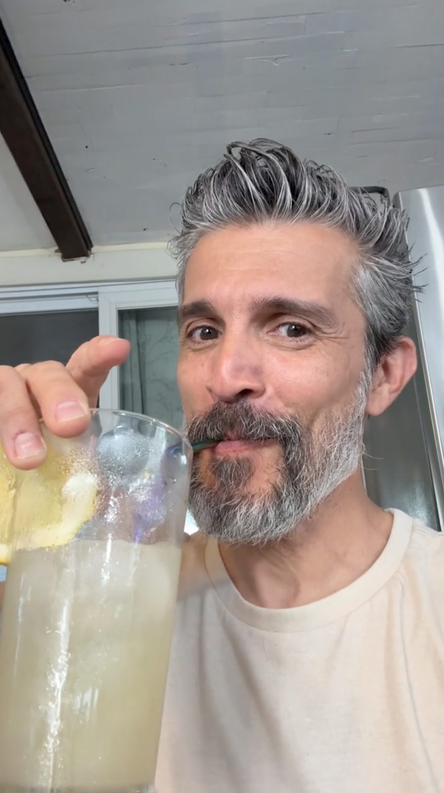 Man sipping Ü Relax lemon lime over ice